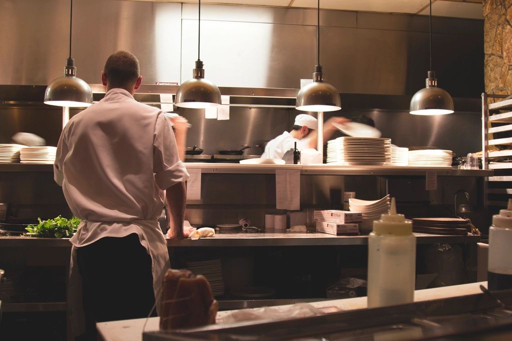 A cook working at the open kitchen