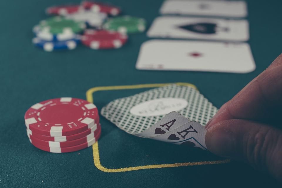Gaming chips and cards on the table felt