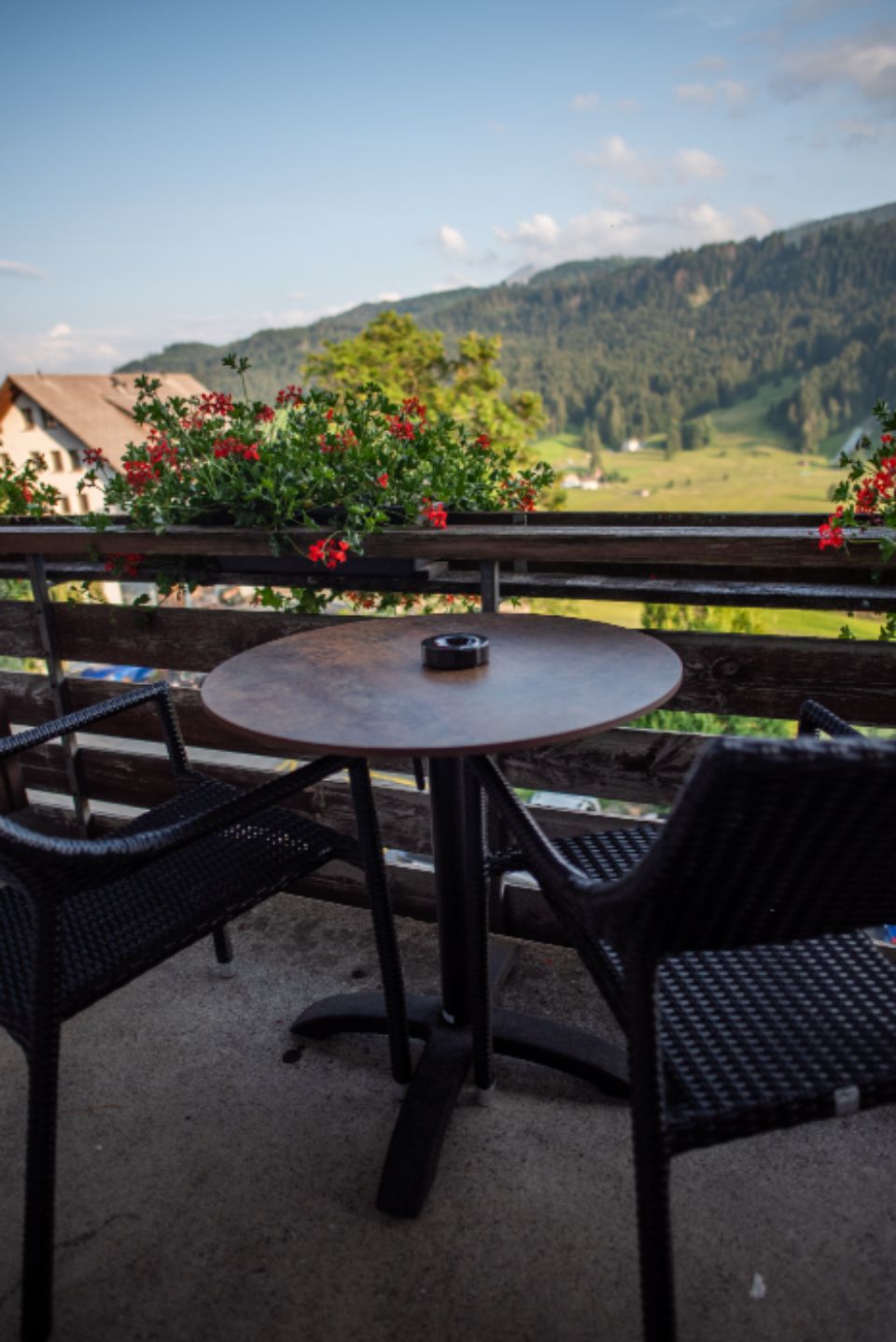 A private terrace with outdoor seating and a view